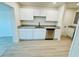 Newly remodeled kitchen offers white cabinets, modern countertops, and stainless appliances at 232 Thomas Ave, Frostproof, FL 33843