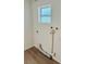 Bright laundry room featuring hookups, a window, and clean white walls at 232 Thomas Ave, Frostproof, FL 33843