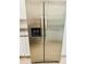 Stainless steel refrigerator with dispenser, an elegant appliance addition to the kitchen at 232 Thomas Ave, Frostproof, FL 33843