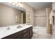 Bathroom showcasing a dual sink vanity, full tub and shower, and stylish decor at 3758 Voyageurs Ct, Apopka, FL 32712