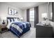 Inviting bedroom with a plush bed, warm lighting, and modern decor for a restful retreat at 3758 Voyageurs Ct, Apopka, FL 32712