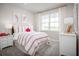 Bright bedroom with a comfortable bed, a large window, and soft carpet for a cozy feel at 3758 Voyageurs Ct, Apopka, FL 32712