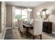 Elegant dining room with chandelier lighting, seating for six, and neutral decor at 3758 Voyageurs Ct, Apopka, FL 32712