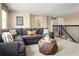 Cozy loft area with plush seating and a view of the staircase at 3758 Voyageurs Ct, Apopka, FL 32712