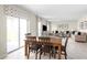 Open floor plan with dining area, seamlessly connected to the living room, and sliding glass doors at 2146 Tennessee St, Sumterville, FL 33585
