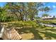 This backyard has large shade trees and a pond, ideal for relaxation and recreation at 13700 Sw 108Th Ln, Dunnellon, FL 34432