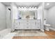 Modern bathroom features a double vanity, sleek fixtures, and a beautifully tiled walk-in shower at 13700 Sw 108Th Ln, Dunnellon, FL 34432