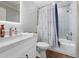 Bathroom features a shower over tub, modern fixtures, and neutral-toned décor with marble counter top at 13700 Sw 108Th Ln, Dunnellon, FL 34432