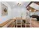 Bright dining area features wooden floors, decorative accents, and seamless access to the living spaces at 13700 Sw 108Th Ln, Dunnellon, FL 34432