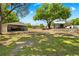 Property features covered parking and workshop spaces on the grounds, shaded by mature trees at 13700 Sw 108Th Ln, Dunnellon, FL 34432