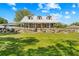 This home features a metal roof, a covered porch, and a large front yard at 13700 Sw 108Th Ln, Dunnellon, FL 34432