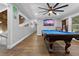 Spacious game room featuring a pool table and modern amenities at 13700 Sw 108Th Ln, Dunnellon, FL 34432