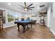 Large game room with a pool table, TV, and plenty of space for entertaining guests at 13700 Sw 108Th Ln, Dunnellon, FL 34432