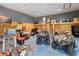 A large garage has been turned into a storage space, accommodating two ATVs and various supplies at 13700 Sw 108Th Ln, Dunnellon, FL 34432