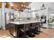 Modern kitchen with stainless steel appliances, a large island, and ample cabinet space for storage at 13700 Sw 108Th Ln, Dunnellon, FL 34432