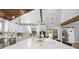 Bright kitchen with custom cabinets, stainless appliances, large island, and an eat-in breakfast area at 13700 Sw 108Th Ln, Dunnellon, FL 34432