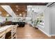 Open-concept kitchen with a large island, modern appliances, and wood-paneled ceilings at 13700 Sw 108Th Ln, Dunnellon, FL 34432