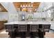 A spacious kitchen with a large island, stainless steel appliances, and a view into the living room at 13700 Sw 108Th Ln, Dunnellon, FL 34432