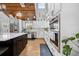 Bright, open kitchen features white cabinets, marble countertops, stainless steel appliances and wood floors at 13700 Sw 108Th Ln, Dunnellon, FL 34432