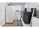 Bright laundry room equipped with a modern washer and dryer, plus extra storage space at 13700 Sw 108Th Ln, Dunnellon, FL 34432