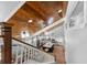 A bright living space is viewed from the top of the stairs at 13700 Sw 108Th Ln, Dunnellon, FL 34432