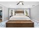 Large main bedroom featuring a ceiling fan, neutral colors, and natural light at 13700 Sw 108Th Ln, Dunnellon, FL 34432