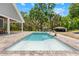 Beautiful pool with a water feature and brick surround, perfect for relaxation and outdoor enjoyment at 13700 Sw 108Th Ln, Dunnellon, FL 34432