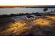 Sunset aerial view of new construction homes with lake view lots in a developing neighborhood at 1556 Covey Rise Ter, Winter Haven, FL 33884