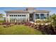Charming single-story home with manicured lawn, colorful landscaping, and attached two car garage at 1556 Covey Rise Ter, Winter Haven, FL 33884