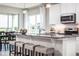 Modern kitchen with granite countertops, stainless steel appliances, a breakfast bar, and pendant lighting at 1556 Covey Rise Ter, Winter Haven, FL 33884