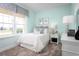 Bright bedroom featuring a large window, comfortable bed, and stylish decor creating a relaxing atmosphere at 1560 Covey Rise Ter, Winter Haven, FL 33884