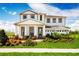 Beautiful two-story home with a landscaped yard, covered entry, and three car garage at 3190 Tiger Palm Way, New Smyrna Beach, FL 32168