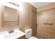 Well lit bathroom featuring modern fixtures, a single vanity, and tiled shower at 2955 Se 156Th Place Rd, Summerfield, FL 34491