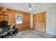 Bedroom featuring wood-look floors, wood paneling, a closet, and a ceiling fan at 2955 Se 156Th Place Rd, Summerfield, FL 34491