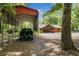 Exterior view of the log cabin home, complemented by an outdoor carport and verdant trees at 2955 Se 156Th Place Rd, Summerfield, FL 34491