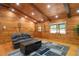 Bright and spacious living room featuring a wooden ceiling, a comfortable sofa, and natural light at 2955 Se 156Th Place Rd, Summerfield, FL 34491