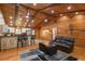 Inviting open living space with wooden floors, wood ceilings, breakfast bar and comfortable seating at 2955 Se 156Th Place Rd, Summerfield, FL 34491