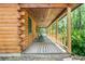 Cozy covered porch with rocking chairs, perfect for enjoying the natural surroundings at 2955 Se 156Th Place Rd, Summerfield, FL 34491