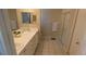 Bathroom featuring a double vanity, tile flooring, and walk-in shower at 3806 Osprey Pointe Cir, Winter Haven, FL 33884