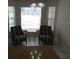 Cozy breakfast nook filled with natural light, featuring two chairs and a small table near large windows at 3806 Osprey Pointe Cir, Winter Haven, FL 33884
