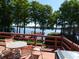 Relaxing lake view from the deck, with a cozy seating area perfect for enjoying the outdoors at 3806 Osprey Pointe Cir, Winter Haven, FL 33884