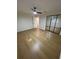 Spacious bedroom with ample closet space, ceiling fan, and wood-look flooring at 601 Lantern Ln, Orange City, FL 32763