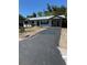 Charming single-story home featuring a newly paved driveway and metal roof at 601 Lantern Ln, Orange City, FL 32763