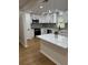 Bright, updated kitchen featuring white cabinets, stainless steel appliances, and a center island at 601 Lantern Ln, Orange City, FL 32763