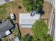 Aerial view of a well-maintained property featuring a new metal roof and lush backyard at 201 Lake Gene Dr, Longwood, FL 32779