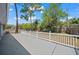 Backyard patio featuring a white railing, providing a space to enjoy the outdoors at 201 Lake Gene Dr, Longwood, FL 32779