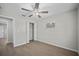 Neutral bedroom with light hardwood floors, ceiling fan and closet with double doors at 201 Lake Gene Dr, Longwood, FL 32779