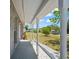 Covered front porch offers a view of the neighborhood and surrounding green space at 201 Lake Gene Dr, Longwood, FL 32779