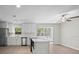 Bright kitchen with stainless appliances, a center island, and an adjacent dining area perfect for entertaining at 201 Lake Gene Dr, Longwood, FL 32779