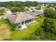 Expansive backyard with lush lawn and inviting patio area, perfect for outdoor entertaining at 27223 Nostalgia Dr, Leesburg, FL 34748